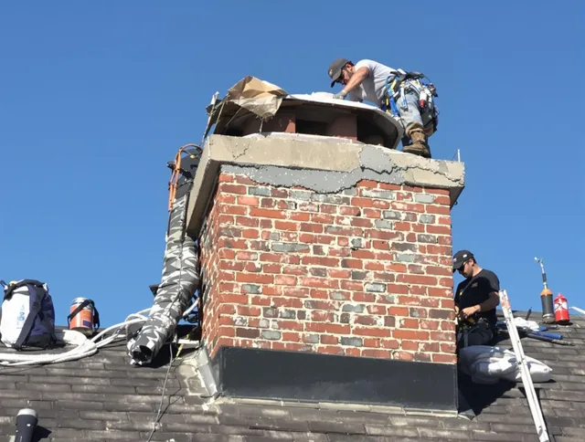 Lewisboro Chimney Sweep installing a custom chimney crown in Lewisboro, NY