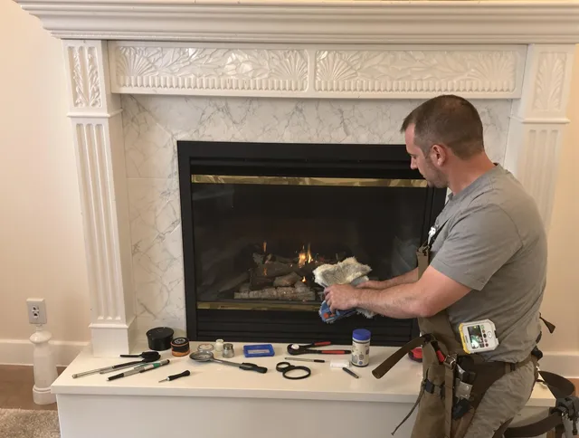 Lewisboro Chimney Sweep performing fireplace maintenance in Lewisboro, NY